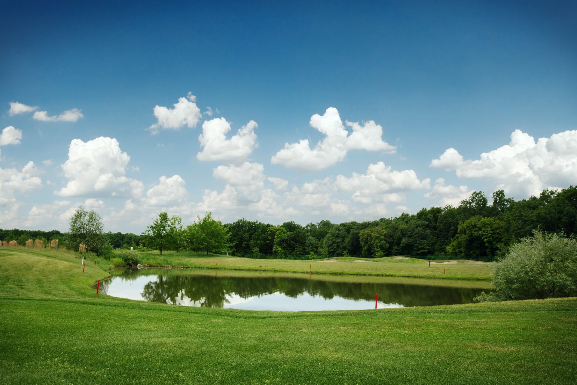 Mirror lake, lawn for golfing on golf course